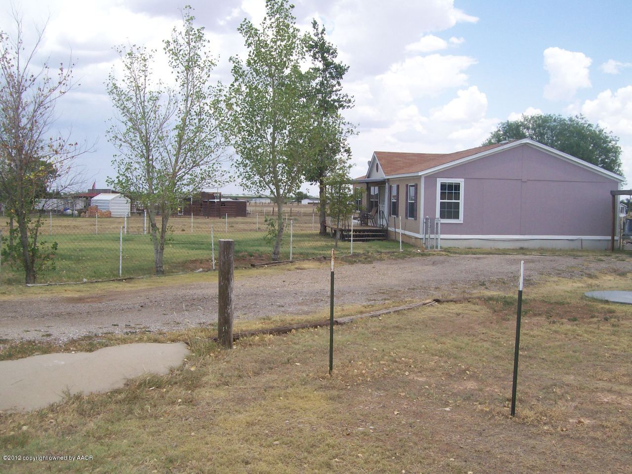 14151 Savannah Road Amarillo, TX 79118 - Photo 3 of 16 a view of a house with a yard