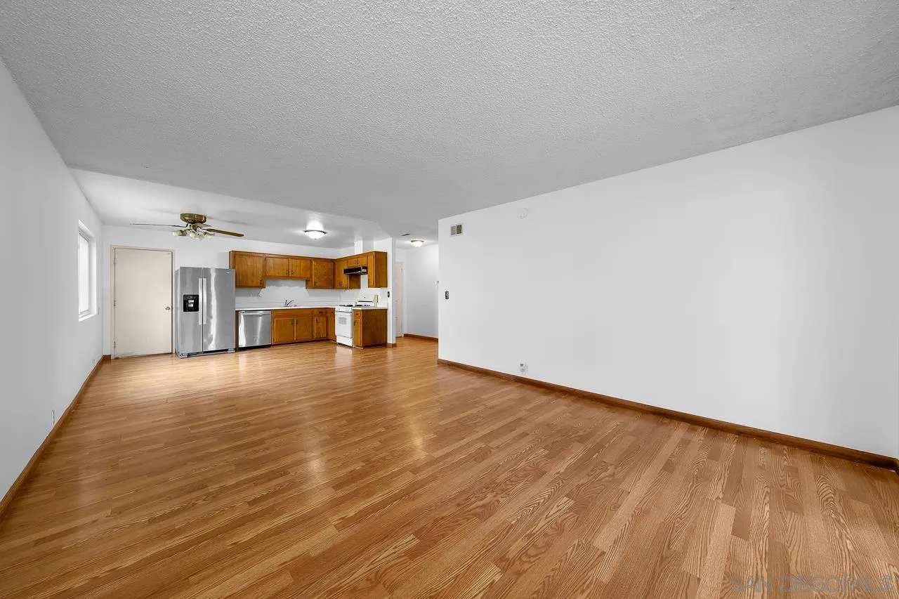 966 27th Street San Diego, CA 92154 - Photo 22 of 33 a view of empty room with wooden floor