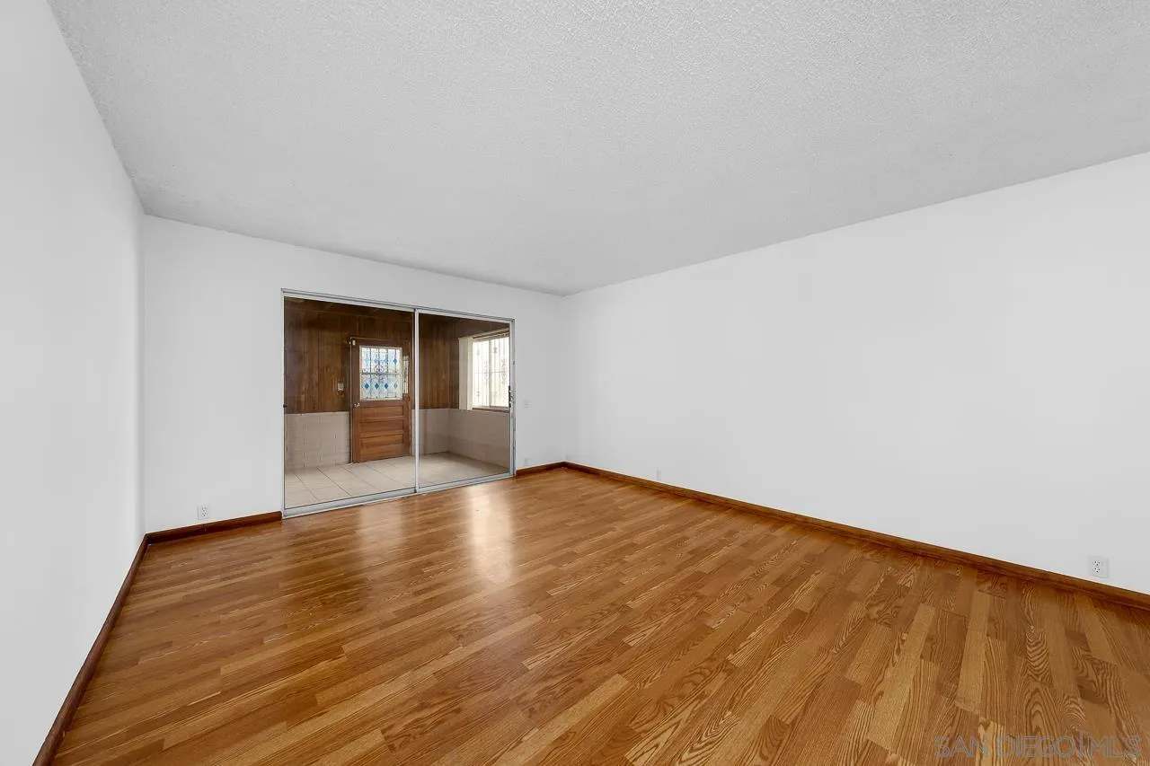 966 27th Street San Diego, CA 92154 - Photo 24 of 33 a view of empty room with wooden floor and fan