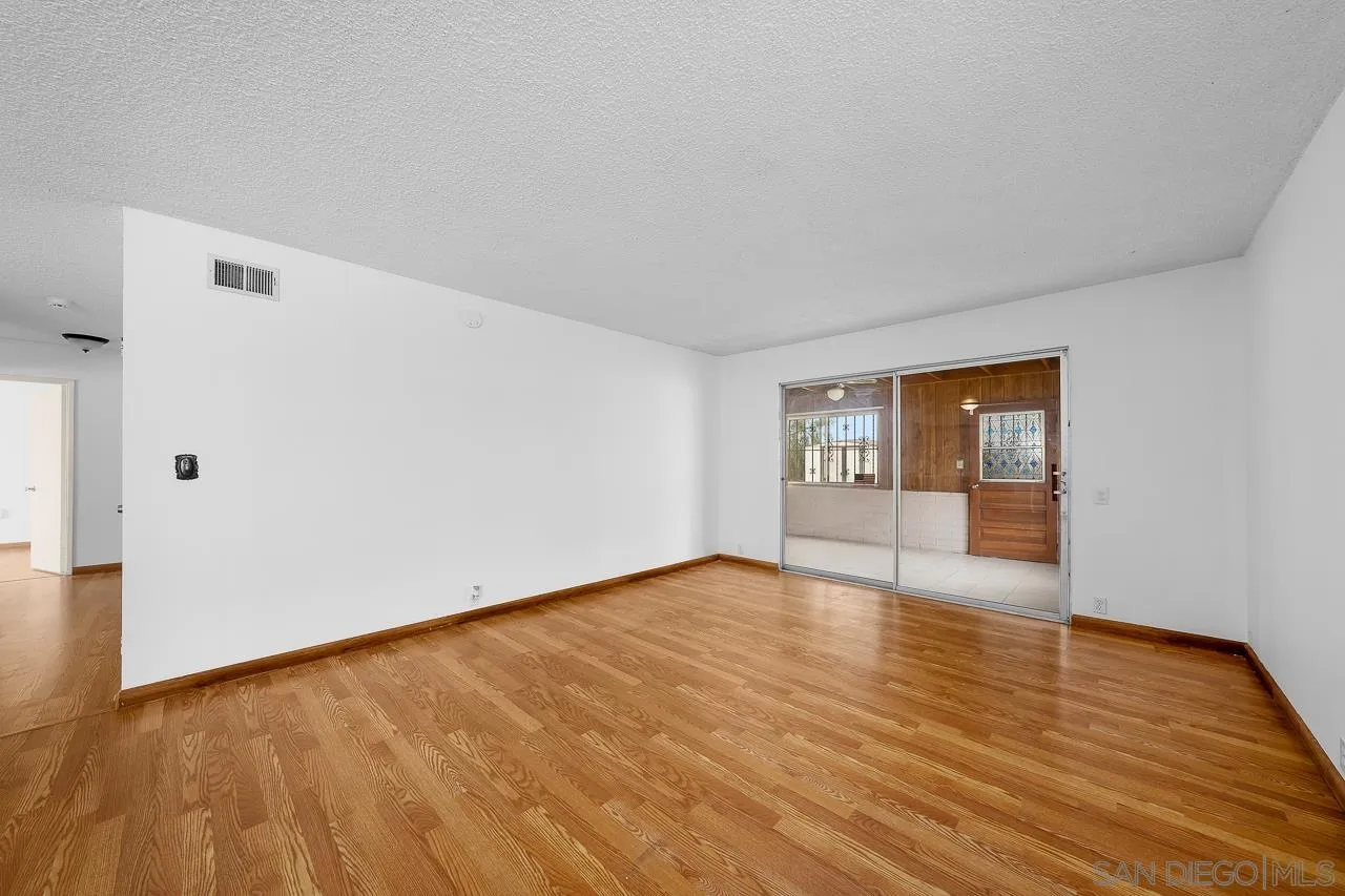 966 27th Street San Diego, CA 92154 - Photo 25 of 33 a view of an empty room and wooden floor