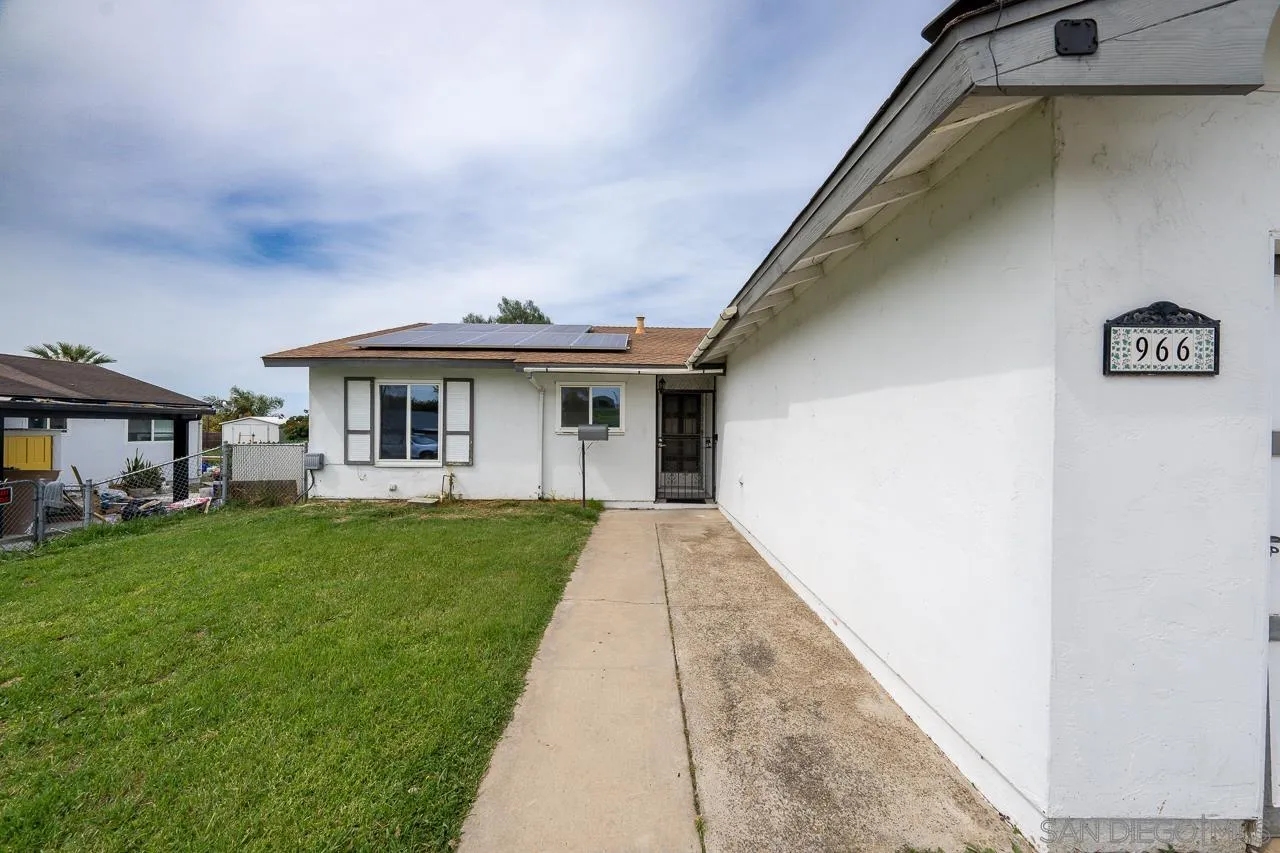 966 27th Street San Diego, CA 92154 - Photo 5 of 33 a view of house with a yard