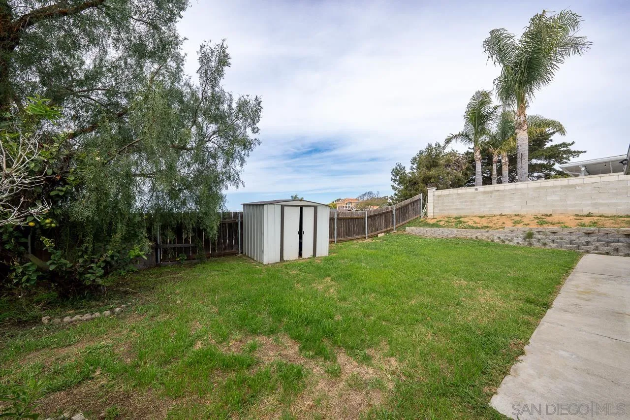966 27th Street San Diego, CA 92154 - Photo 8 of 33 a view of a house with backyard and garden