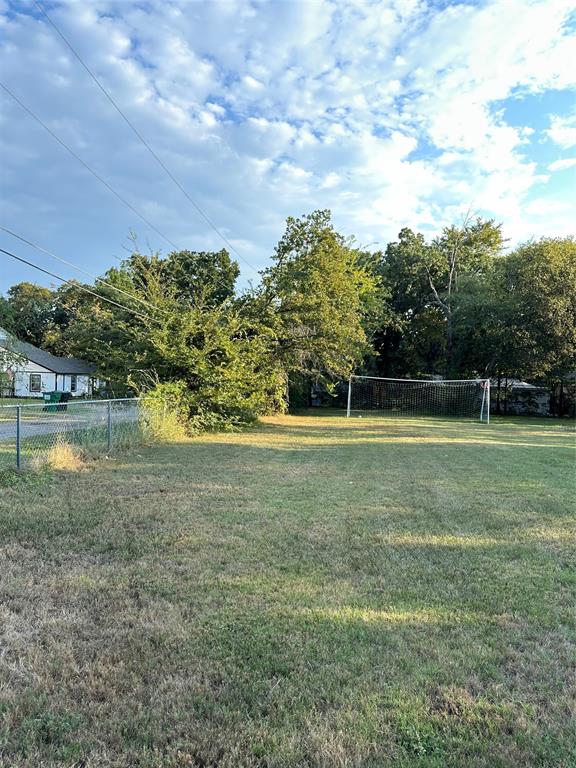 1048 Red Bird Seven Points, TX 75143 - Photo 13 of 28 a view of outdoor space with swimming pool and green space