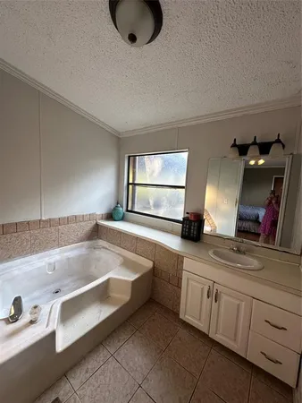 a kitchen with a sink a stove and a window