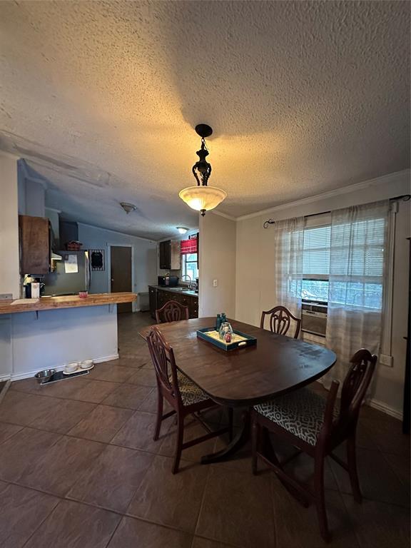 1048 Red Bird Seven Points, TX 75143 - Photo 18 of 28 a view of a dining room with furniture and a chandelier