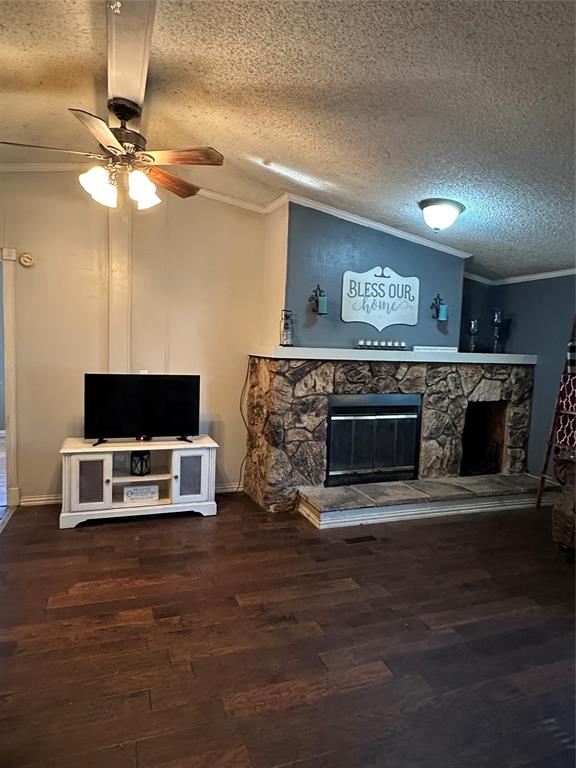 1048 Red Bird Seven Points, TX 75143 - Photo 21 of 28 a living room with furniture a flat screen tv and a fireplace