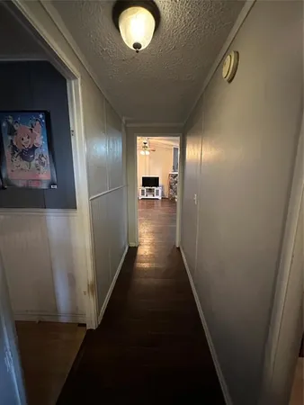 a white toilet sitting next to a shower curtain