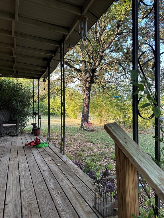 1048 Red Bird Seven Points, TX 75143 - Photo 4 of 28 a view of deck with wooden floor and outdoor seating