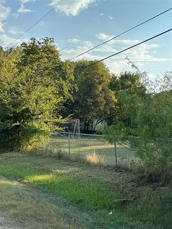 a house view with a backyard space