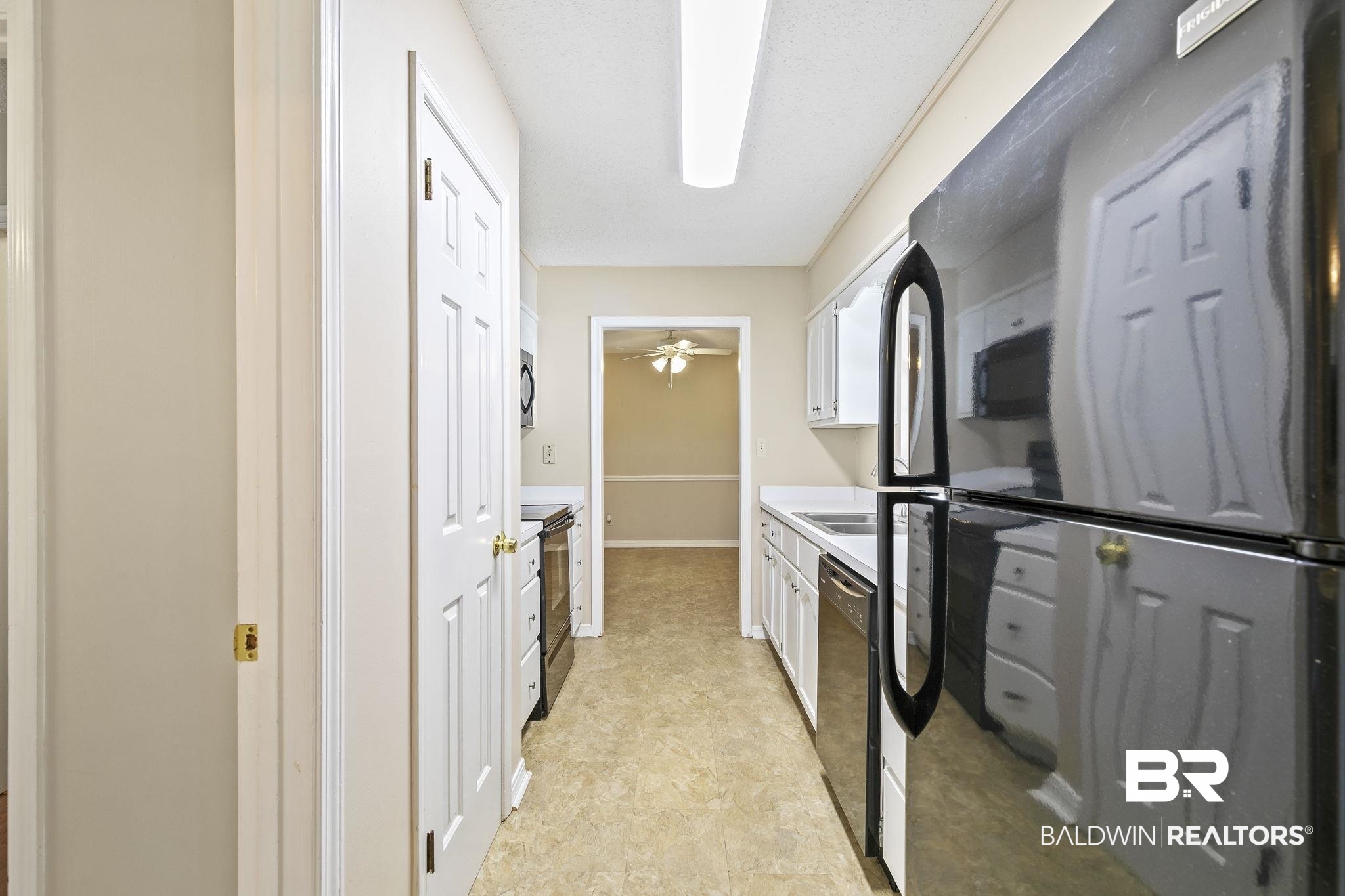 359 Ridgewood Drive Daphne, AL 36526 - Photo 23 of 73 Kitchen featuring ceiling fan, black appliances, and white cabinets