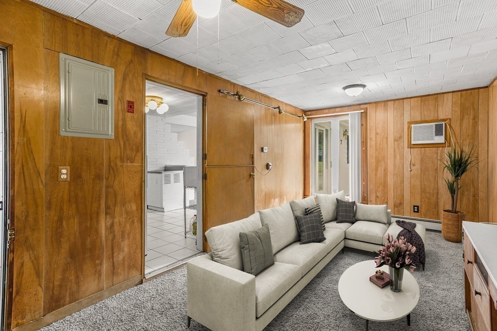7 Ruth Drive Framingham, MA 01701 - Photo 12 of 33 a living room with furniture and a glass door shower