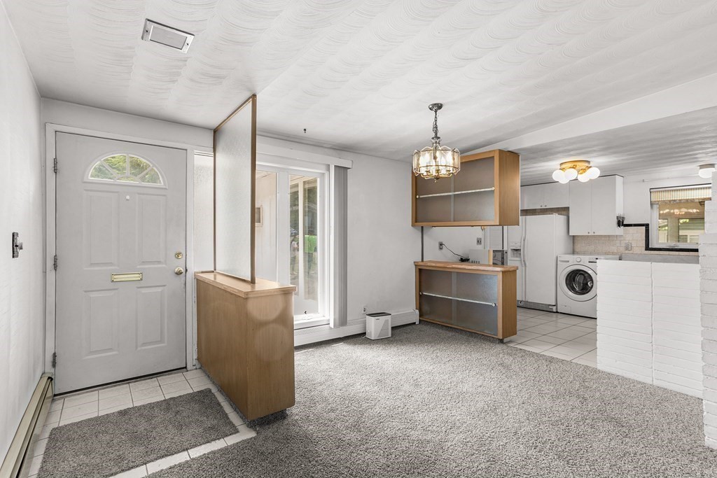 7 Ruth Drive Framingham, MA 01701 - Photo 2 of 33 a view of a kitchen with refrigerator and cabinets