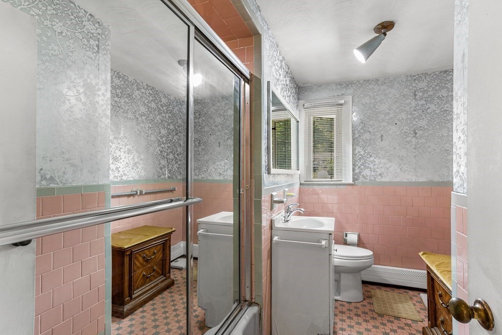 7 Ruth Drive Framingham, MA 01701 - Photo 24 of 33 a bathroom with a toilet a sink and shower