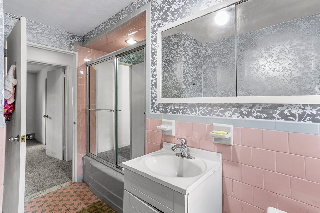 7 Ruth Drive Framingham, MA 01701 - Photo 25 of 33 a bathroom with a sink and a mirror