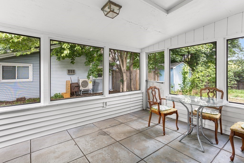 7 Ruth Drive Framingham, MA 01701 - Photo 26 of 33 a view of a dining room with furniture large windows and wooden floor