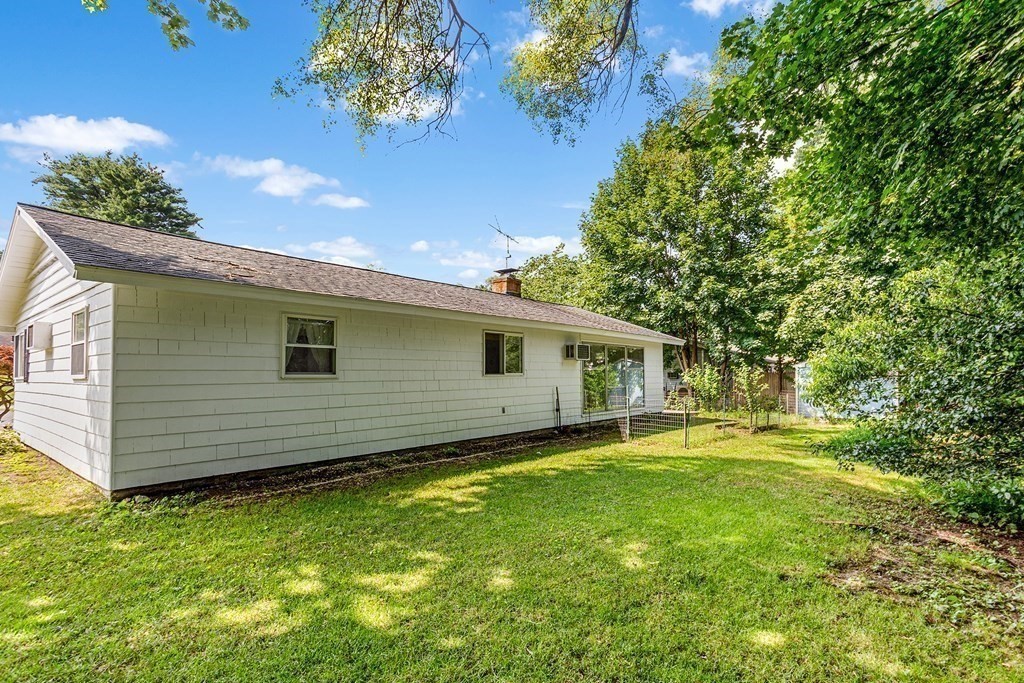 7 Ruth Drive Framingham, MA 01701 - Photo 29 of 33 a backyard of a house with yard and outdoor seating