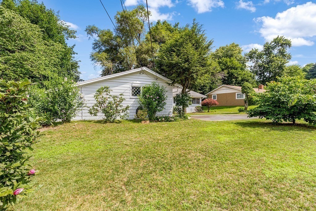 7 Ruth Drive Framingham, MA 01701 - Photo 31 of 33 a front view of a house with garden