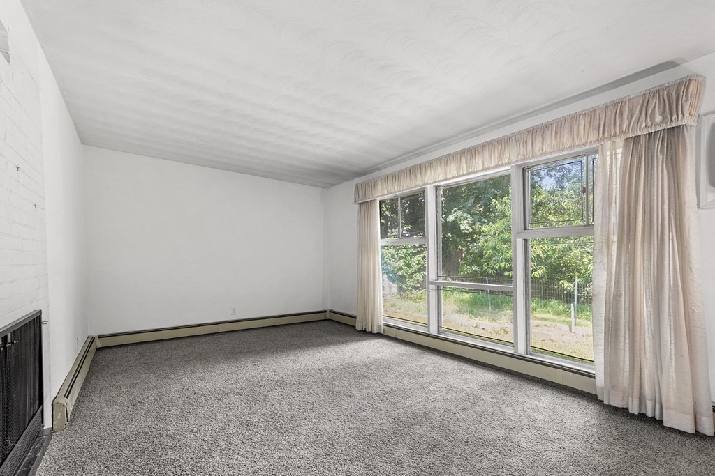 7 Ruth Drive Framingham, MA 01701 - Photo 7 of 33 a view of an empty room with a window