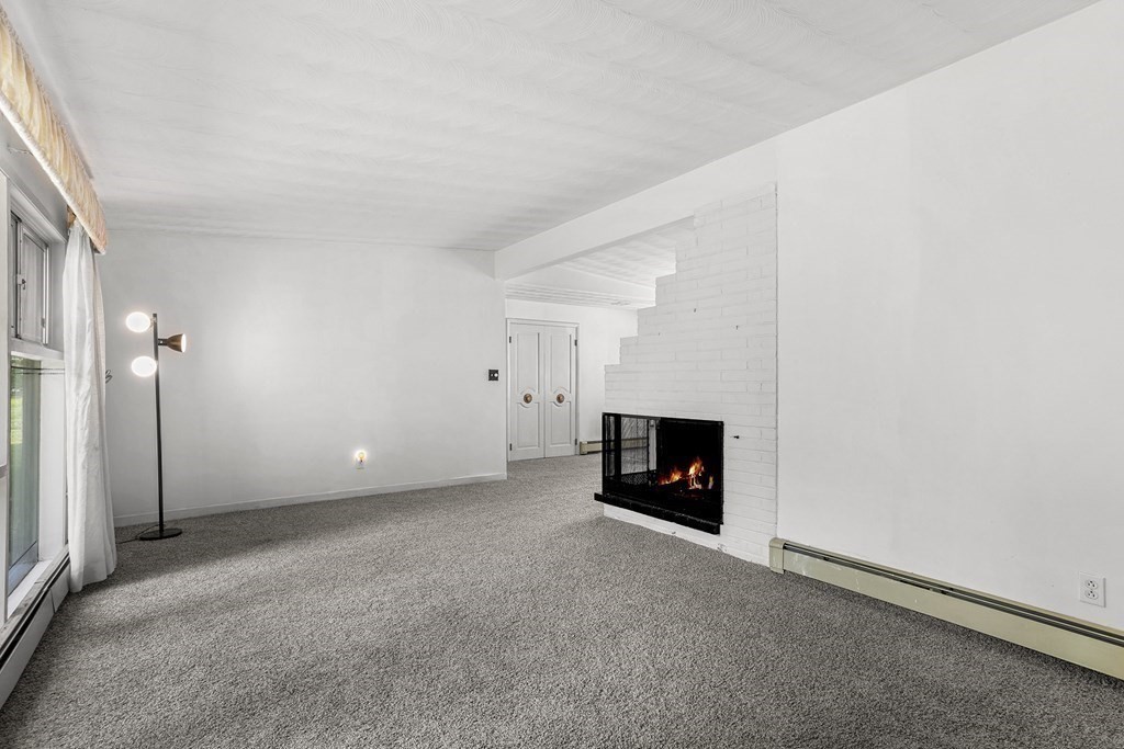 7 Ruth Drive Framingham, MA 01701 - Photo 8 of 33 an empty room with fireplace
