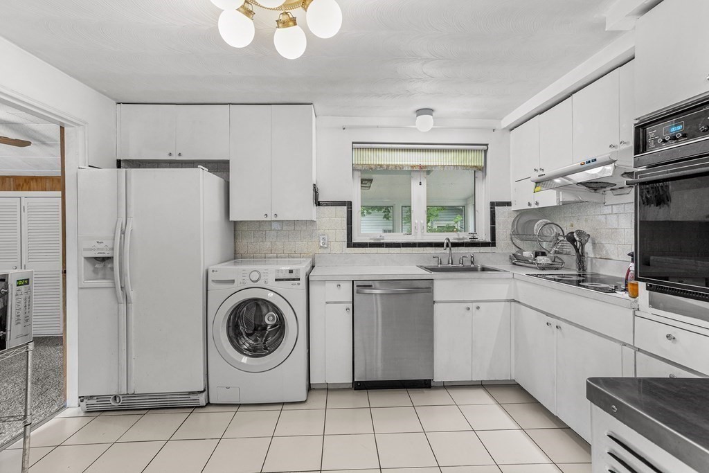 7 Ruth Drive Framingham, MA 01701 - Photo 9 of 33 a utility room with sink dryer and washer