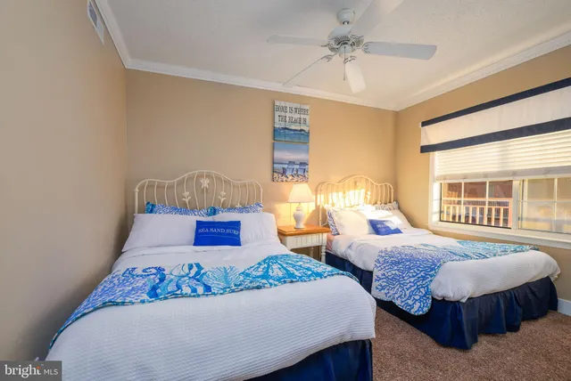 a large white kitchen with stainless steel appliances granite countertop a sink and cabinets