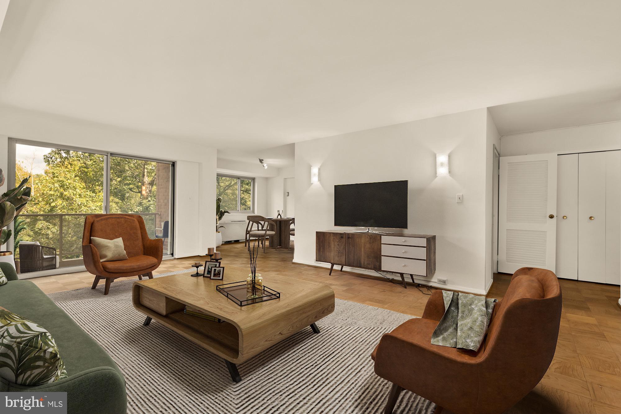 5100 Dorset Avenue, Unit 308 Chevy Chase, MD 20815 - Photo 12 of 31 a living room with furniture and a flat screen tv