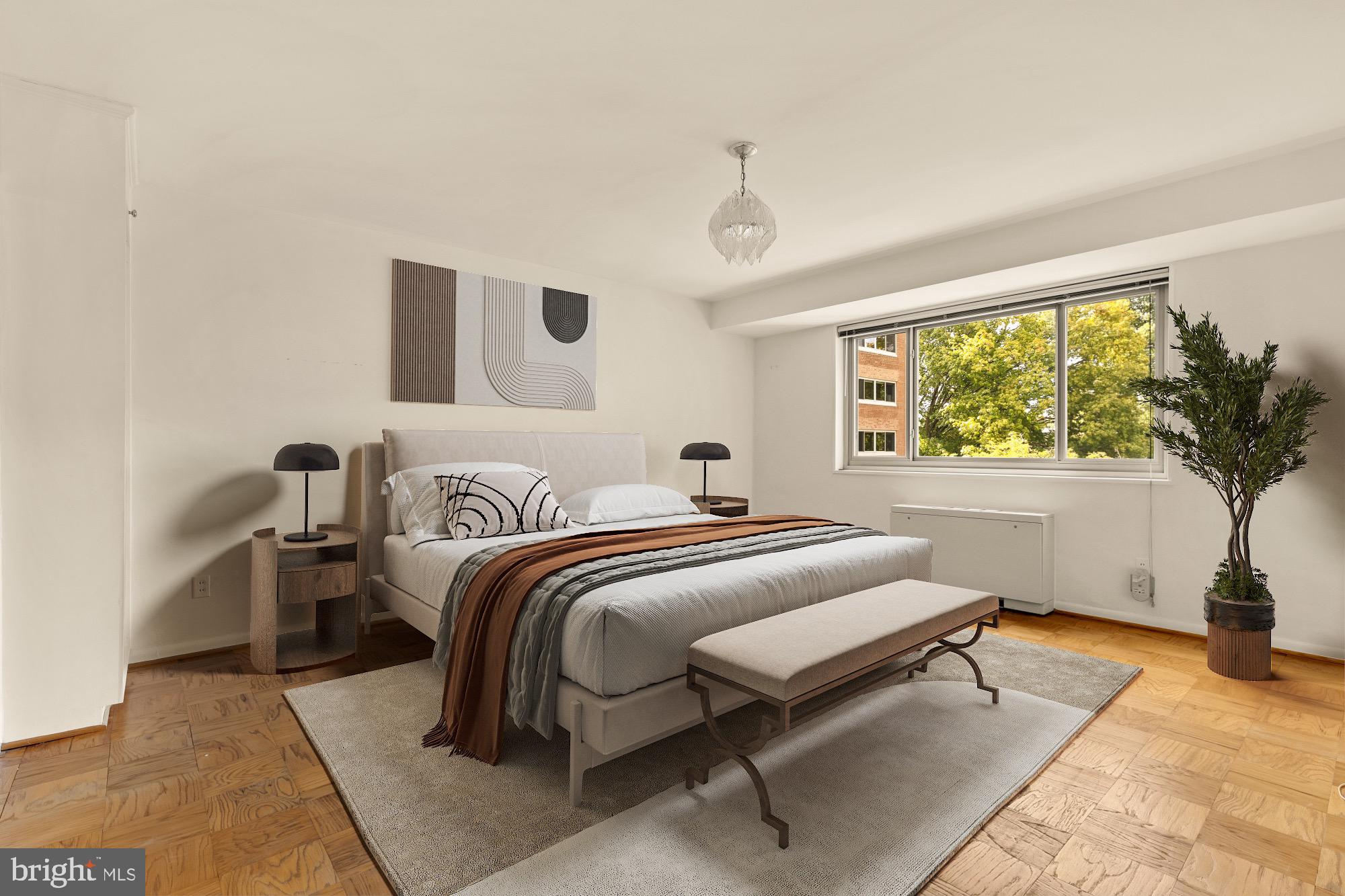 5100 Dorset Avenue, Unit 308 Chevy Chase, MD 20815 - Photo 17 of 31 a bedroom with bed and a large window