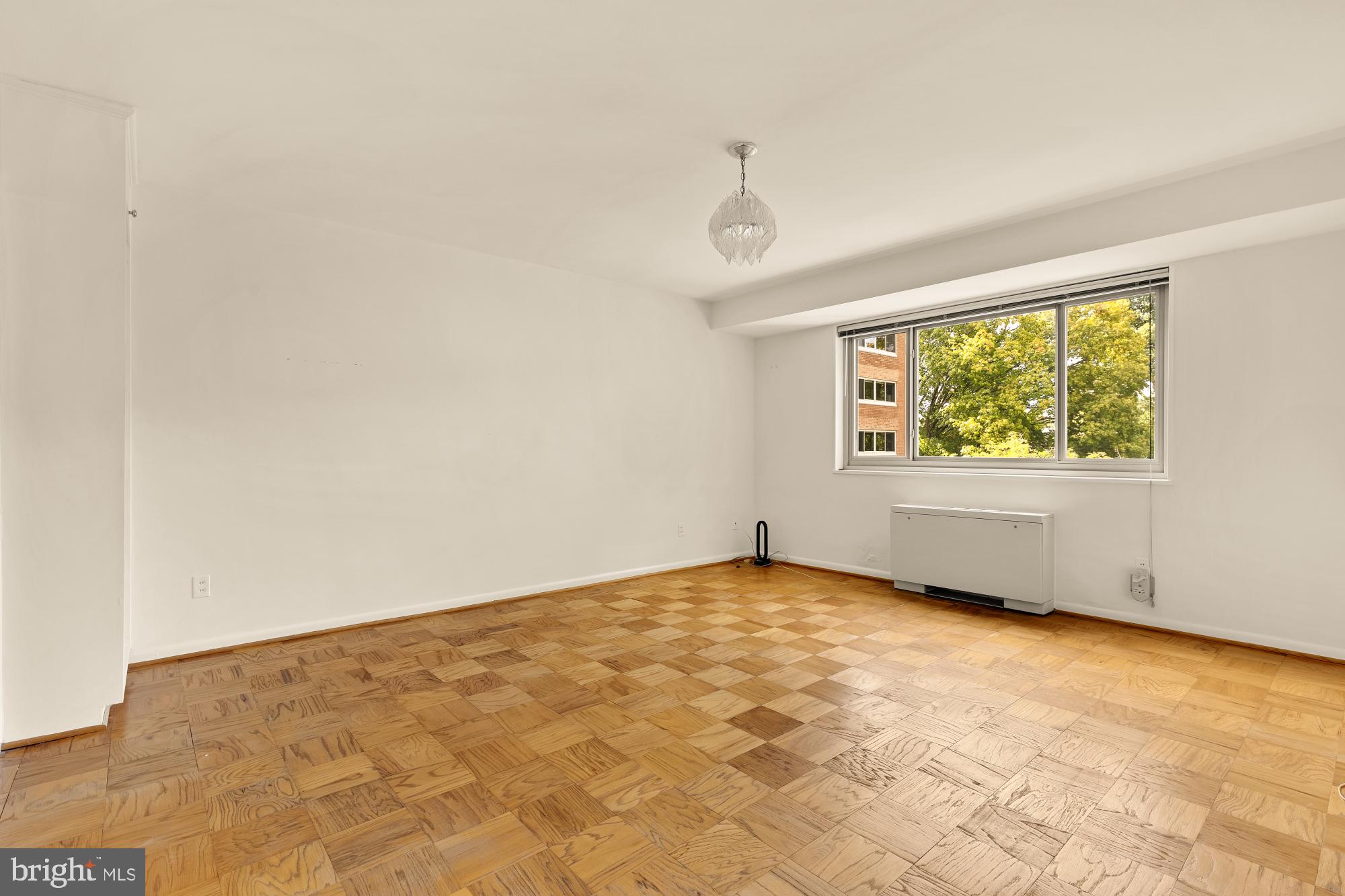 5100 Dorset Avenue, Unit 308 Chevy Chase, MD 20815 - Photo 18 of 31 an empty room with windows