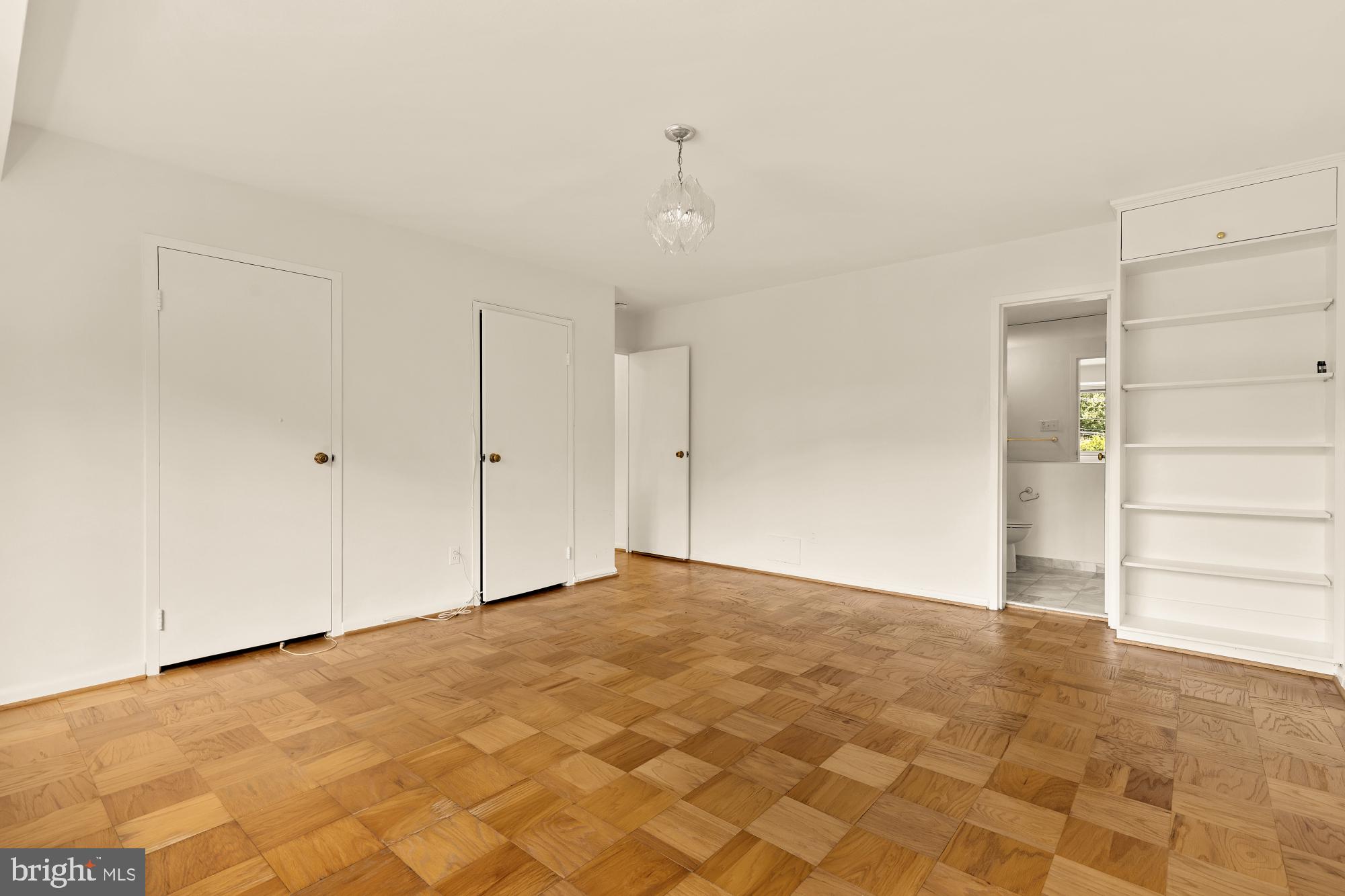 5100 Dorset Avenue, Unit 308 Chevy Chase, MD 20815 - Photo 19 of 31 a view of an empty room with a window