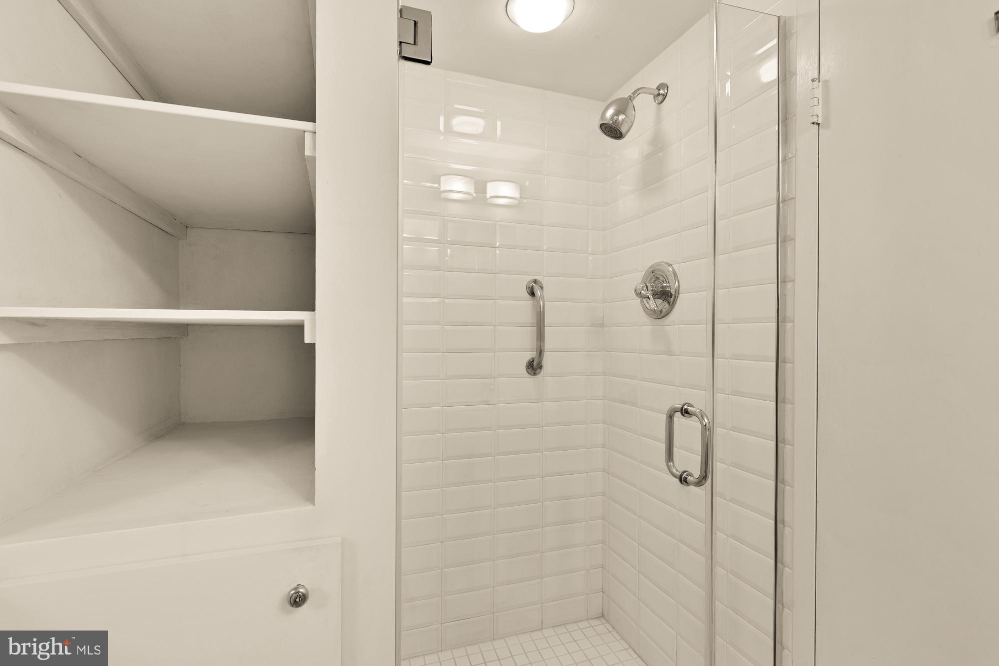 5100 Dorset Avenue, Unit 308 Chevy Chase, MD 20815 - Photo 21 of 31 a bathroom with a shower
