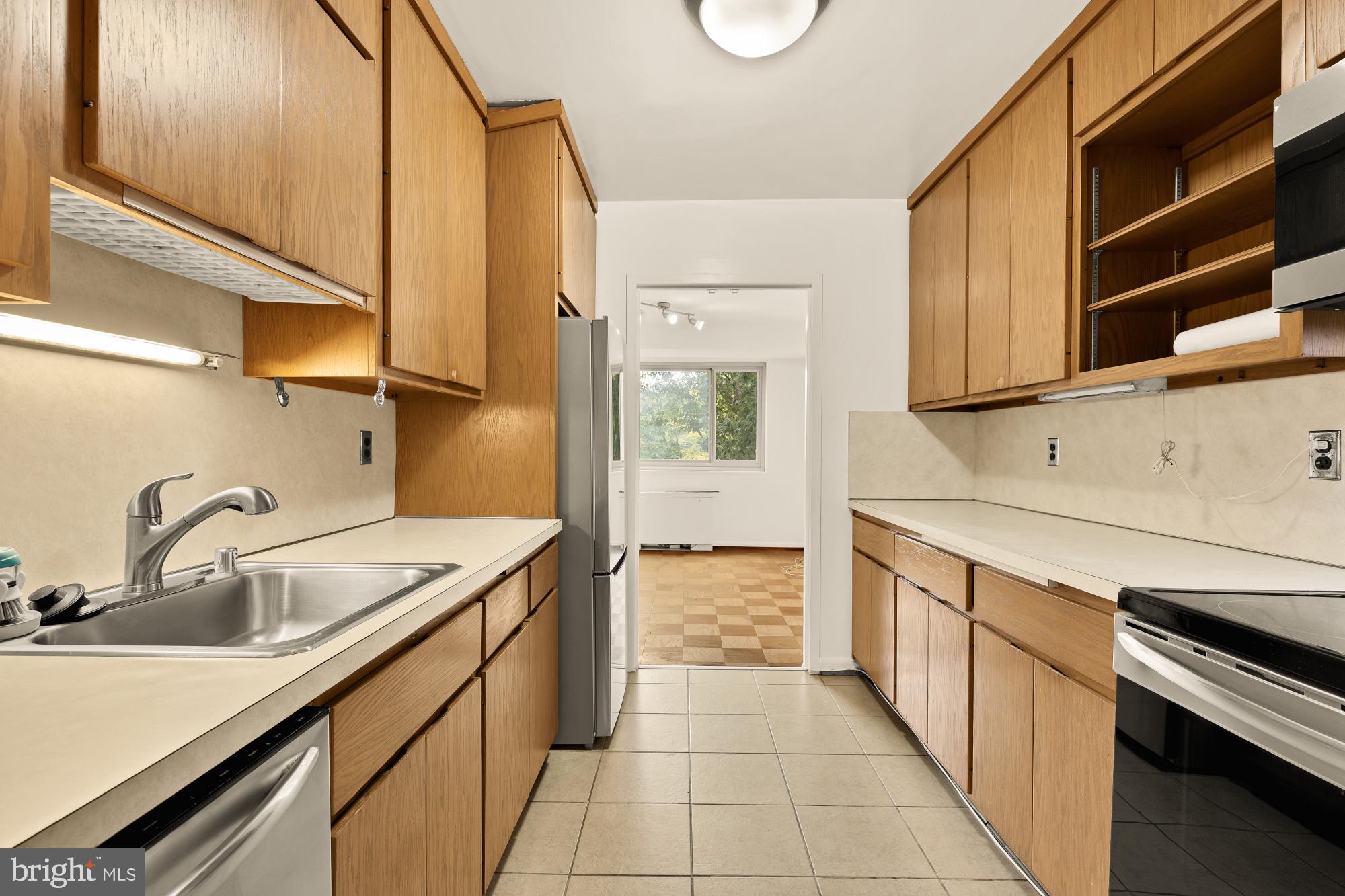 5100 Dorset Avenue, Unit 308 Chevy Chase, MD 20815 - Photo 6 of 31 a kitchen with a sink and cabinets