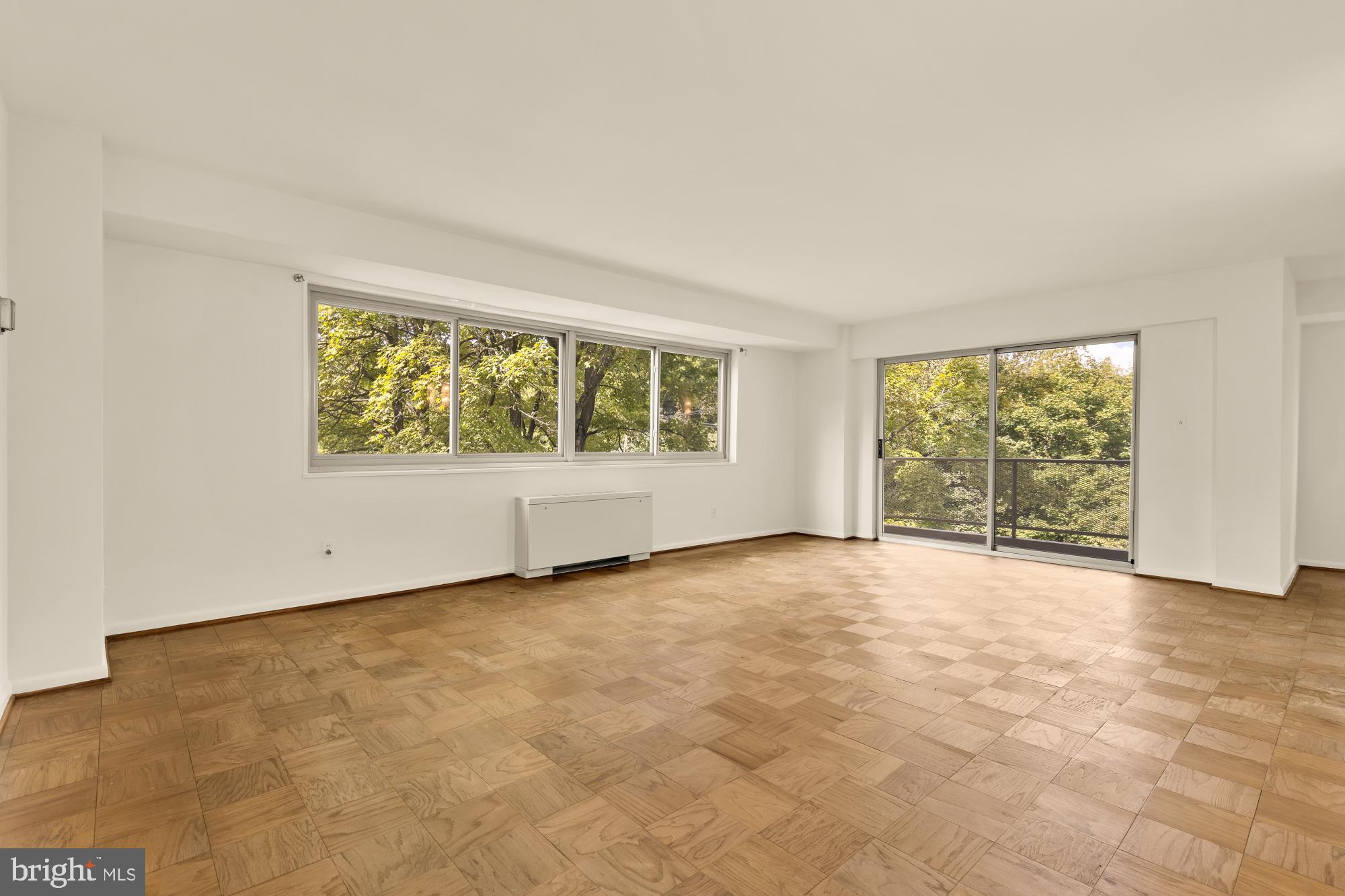 5100 Dorset Avenue, Unit 308 Chevy Chase, MD 20815 - Photo 10 of 31 an empty room with windows