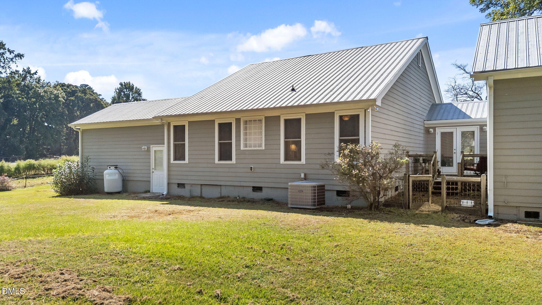 1208 Peach Orchard Road Four Oaks, NC 27524 - Photo 11 of 63 a view of a house with a patio