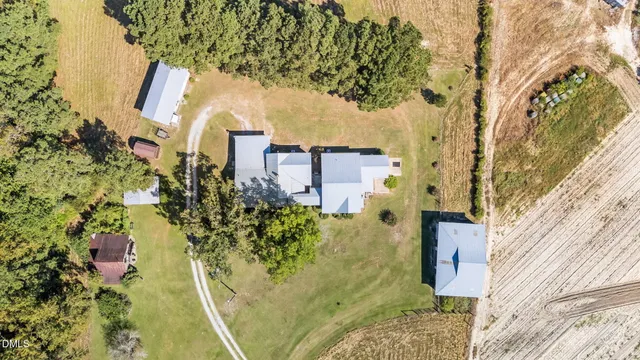 a kitchen with a sink and wooden floor