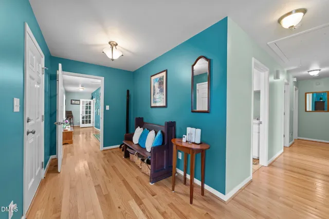 a kitchen with white cabinets and sink