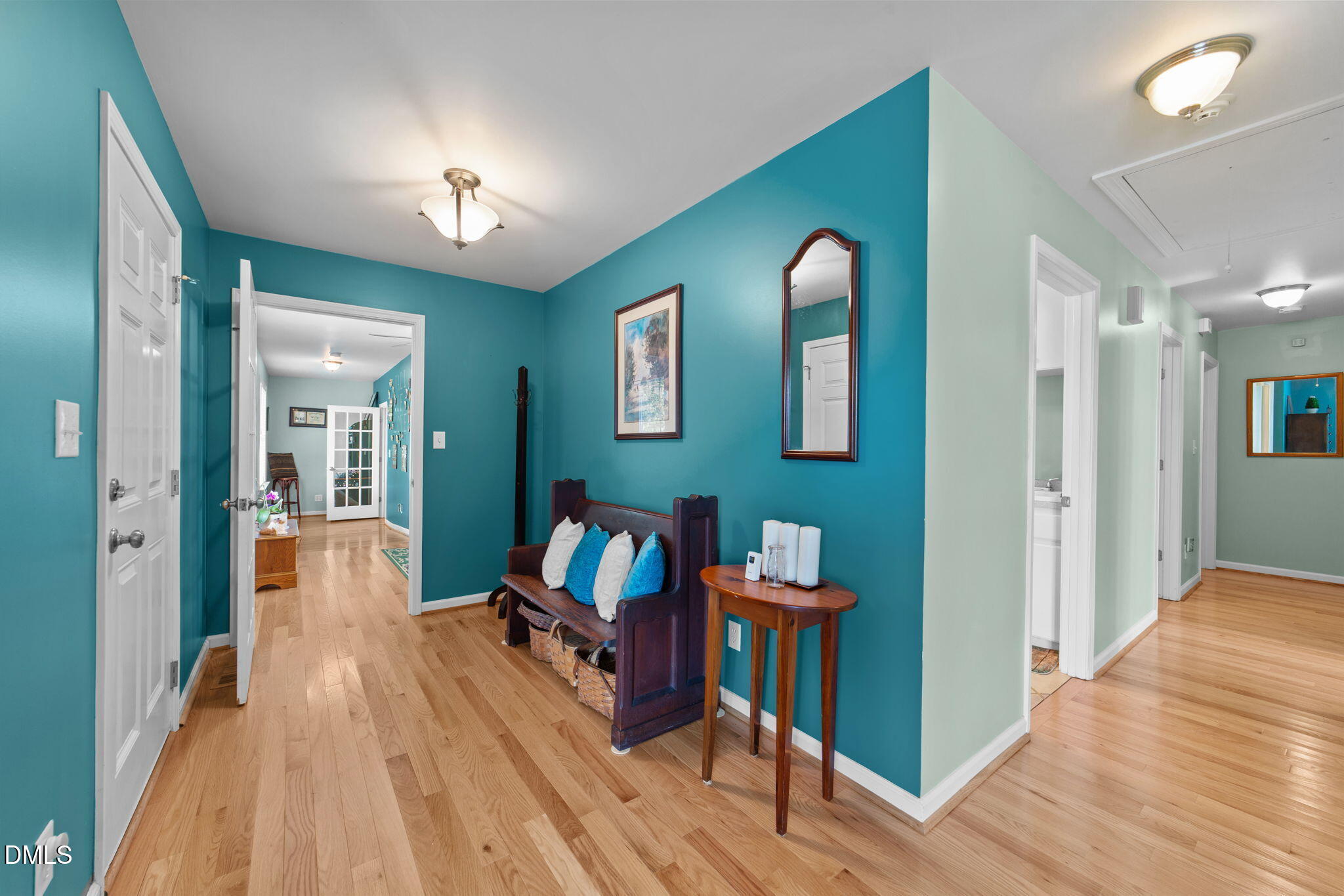 1208 Peach Orchard Road Four Oaks, NC 27524 - Photo 17 of 63 a view of a room with wooden floor and furniture