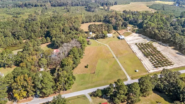 an aerial view of a house with a yard