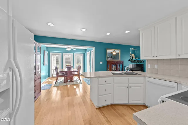 a bedroom with a bed dresser and a window