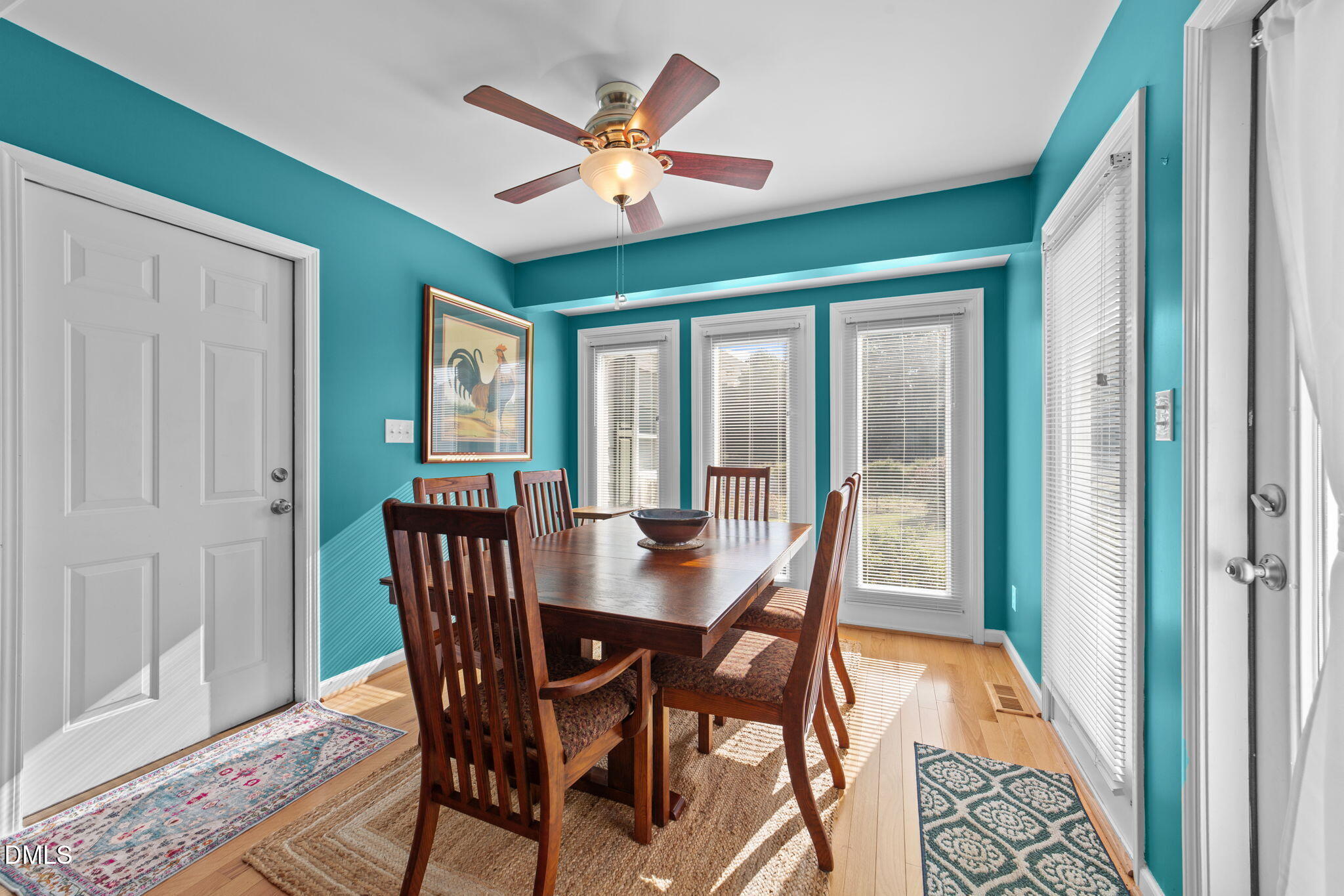 1208 Peach Orchard Road Four Oaks, NC 27524 - Photo 27 of 63 a view of a dining room with furniture window and wooden floor