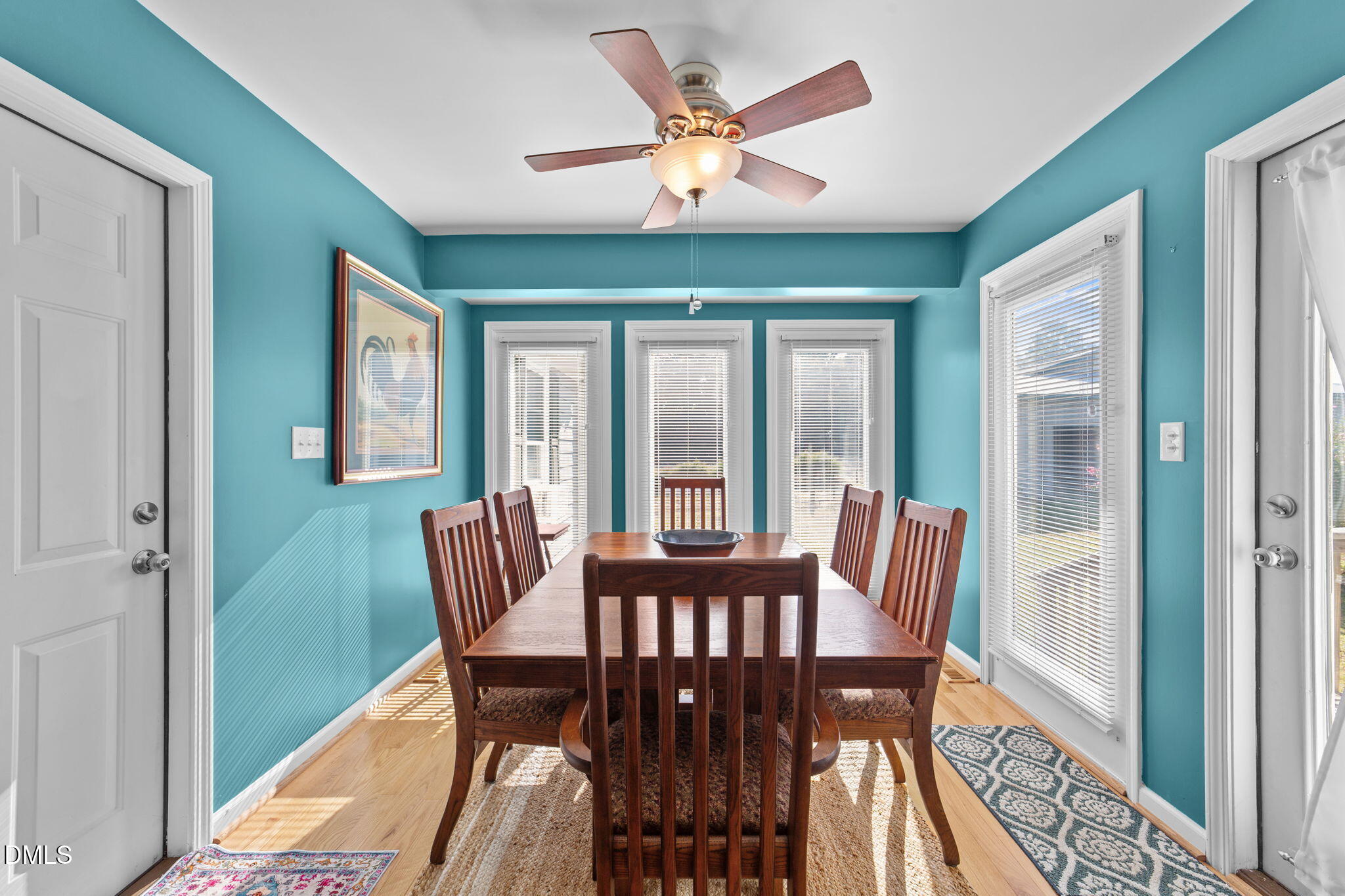 1208 Peach Orchard Road Four Oaks, NC 27524 - Photo 28 of 63 a view of a dining room with furniture window and wooden floor