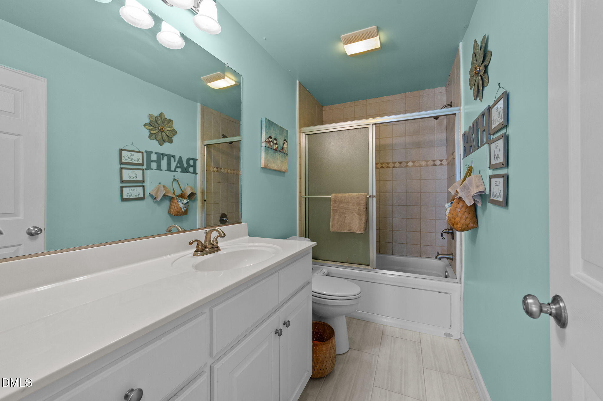 1208 Peach Orchard Road Four Oaks, NC 27524 - Photo 29 of 63 a bathroom with a sink a toilet and shower