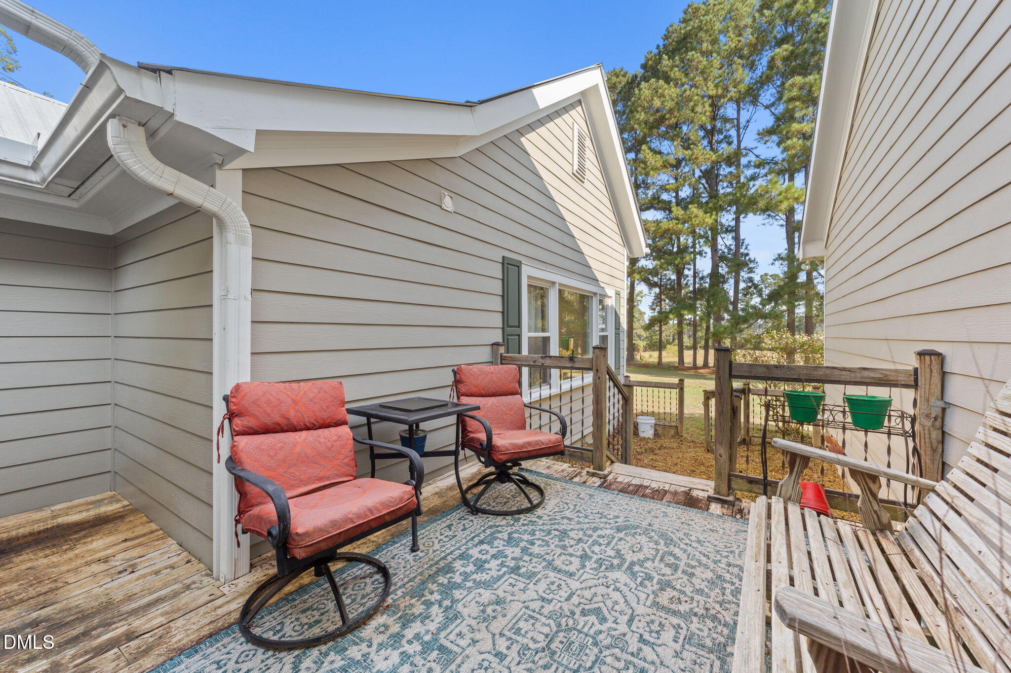 1208 Peach Orchard Road Four Oaks, NC 27524 - Photo 38 of 63 a view of a chairs with a patio