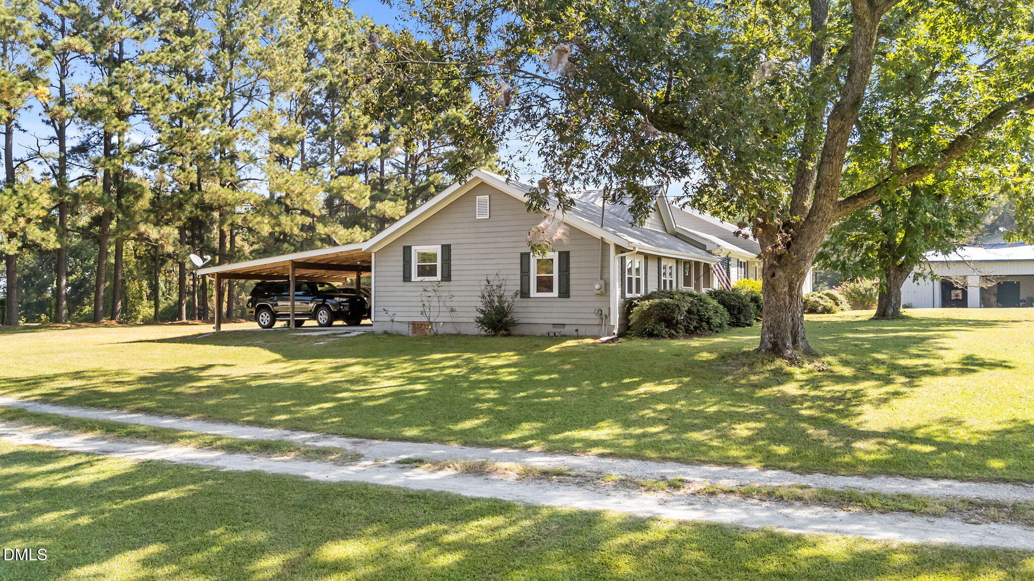 1208 Peach Orchard Road Four Oaks, NC 27524 - Photo 45 of 63 a view of a house with a yard