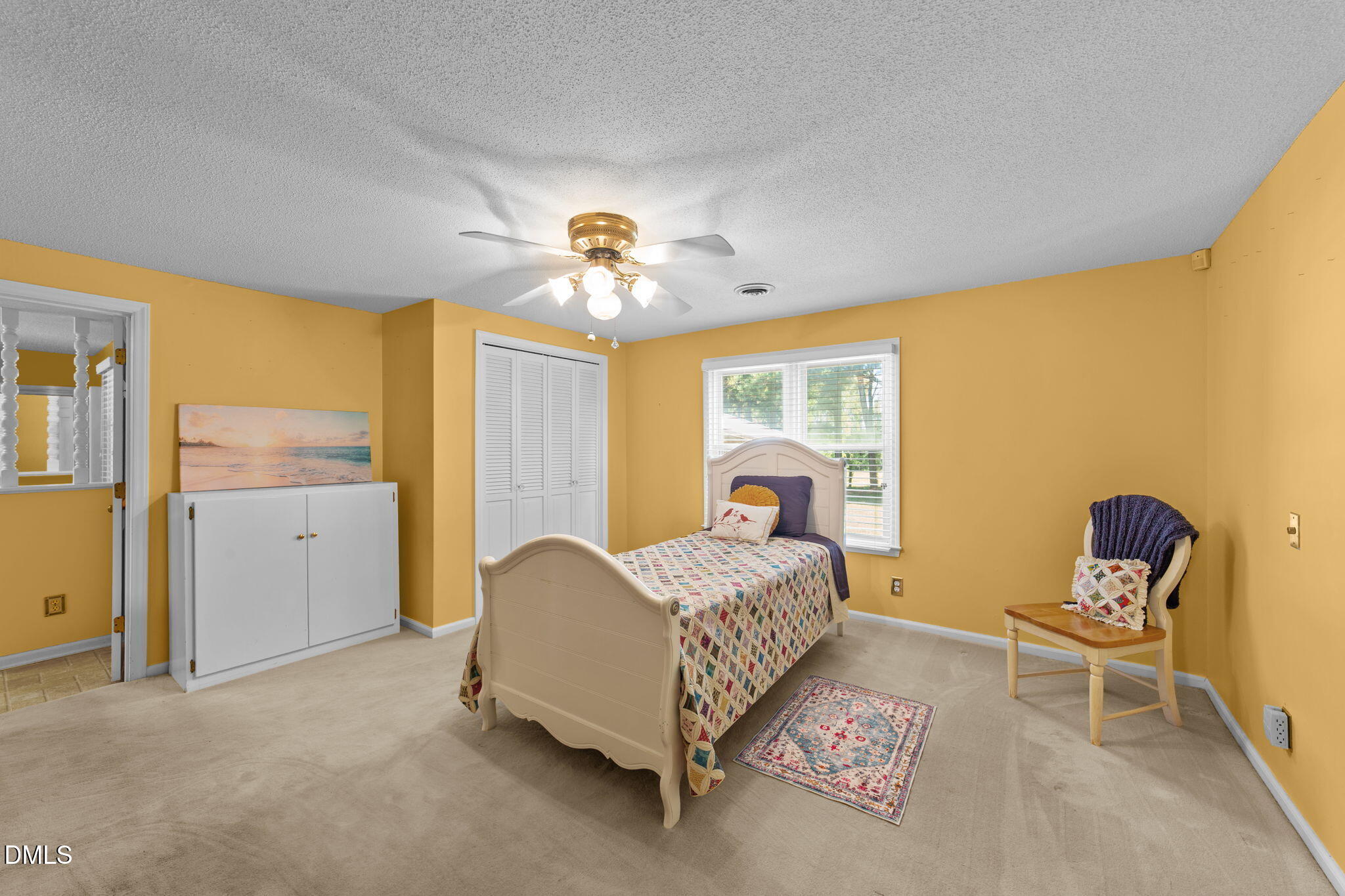 1208 Peach Orchard Road Four Oaks, NC 27524 - Photo 47 of 63 a bed room with a bed and a chair