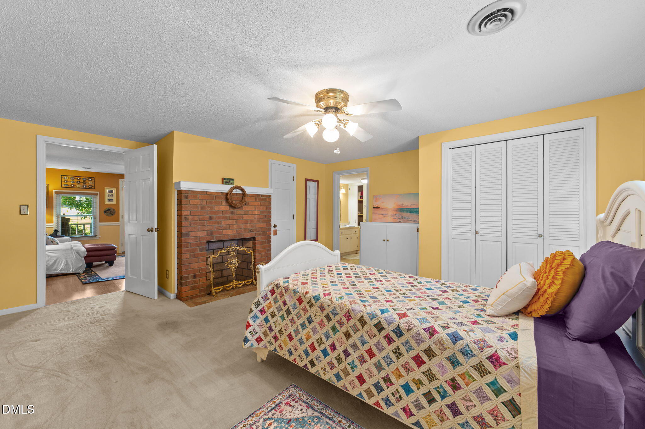 1208 Peach Orchard Road Four Oaks, NC 27524 - Photo 48 of 63 a bedroom with a bed and a chandelier