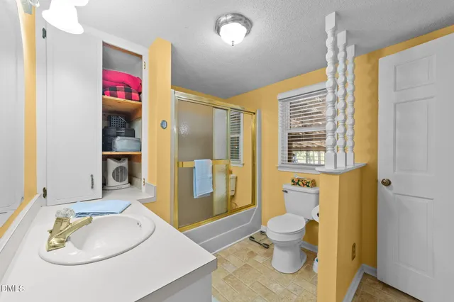 a kitchen with a stove a sink and a refrigerator