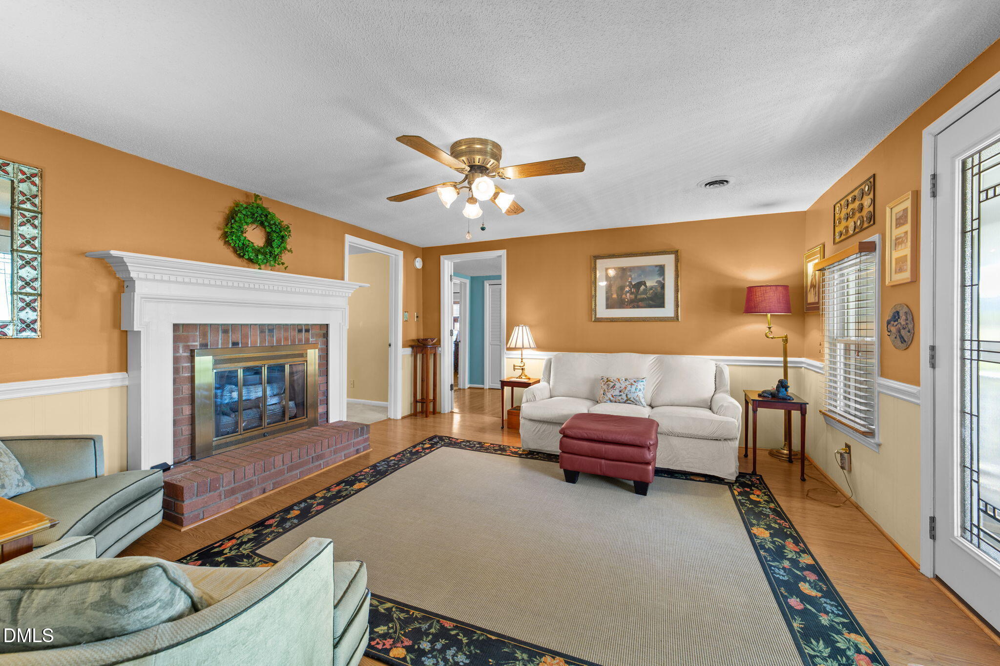 1208 Peach Orchard Road Four Oaks, NC 27524 - Photo 51 of 63 a living room with furniture and a fireplace
