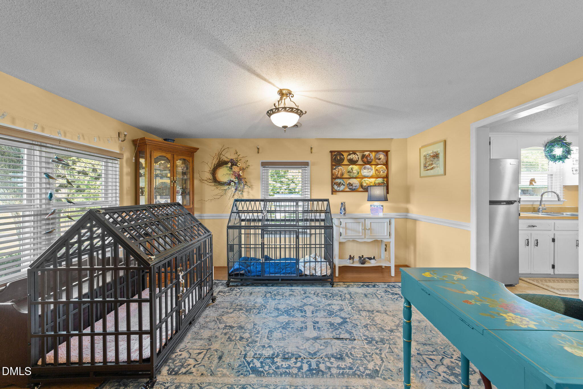 1208 Peach Orchard Road Four Oaks, NC 27524 - Photo 54 of 63 a bedroom with a bed a dresser and next to a window