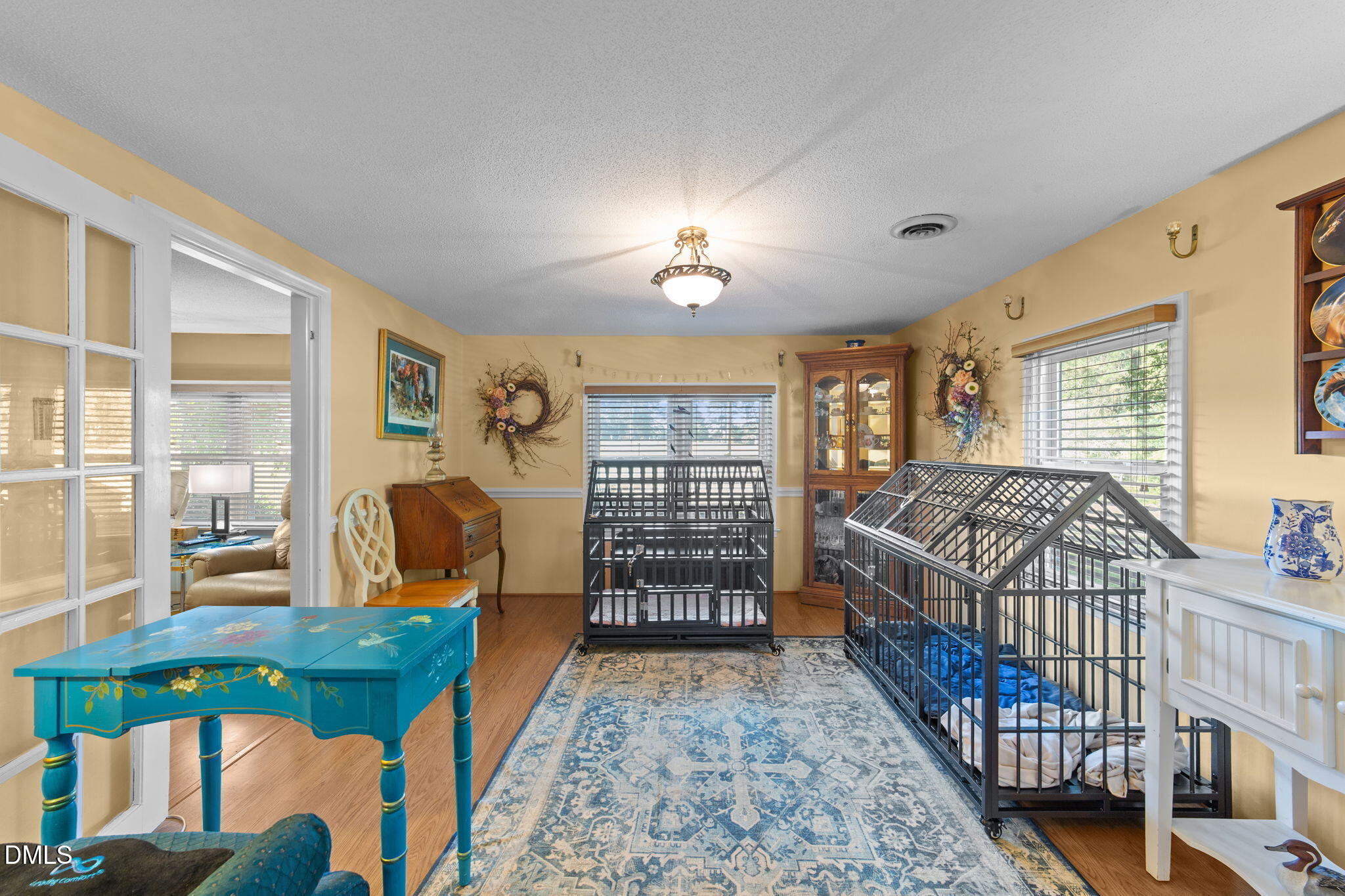 1208 Peach Orchard Road Four Oaks, NC 27524 - Photo 55 of 63 a bedroom with a bed a dresser and a large window