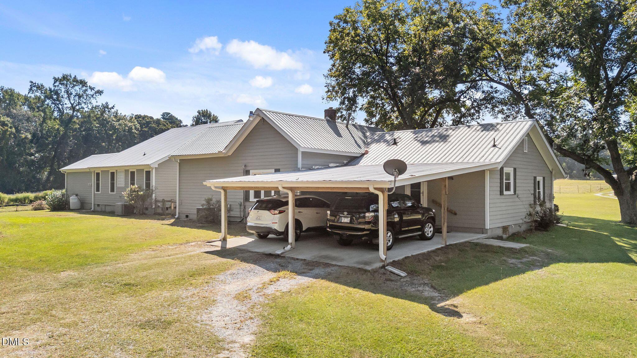 1208 Peach Orchard Road Four Oaks, NC 27524 - Photo 10 of 63 a view of a house with backyard porch and sitting area